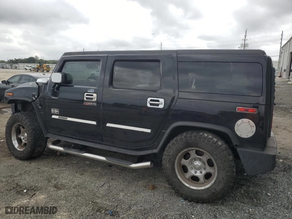 2003 Hummer H2 with VIN 5GRGN23UX3H121939, listed as a Copart auction lot 69503424 with 170,144 mi miles and Salvage Title. Bid and sale history available at carsss.com. Image 2.