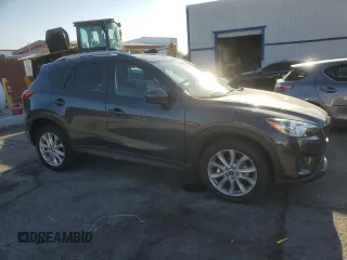 2014 Mazda CX-5 Grand Touring with VIN JM3KE4DY1E0328852, listed as a Copart auction lot 53965265 with 67,242 mi miles and Salvage Title. Bid and sale history available at DreamBid. Image 4.