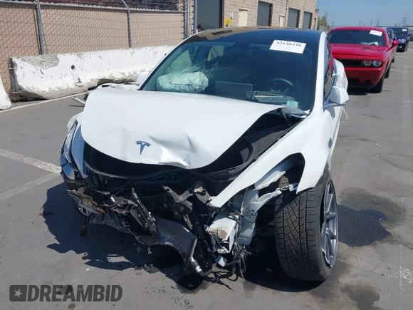 2020 Tesla Model 3 Standard Range Plus with VIN 5YJ3E1EAXLF590591, listed as a IAAI auction lot 42140338 with 79,342 mi miles and . Bid and sale history available at DreamBid. Image 6.