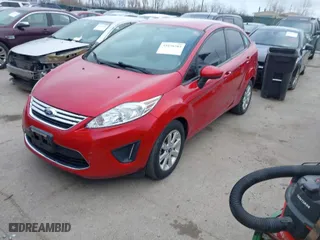2012 Ford Fiesta SE with VIN 3FADP4BJ2CM158678, listed as a IAAI auction lot 41858203 with 144,458 mi miles. Bid and sale history available at carsss.com. Image 2.
