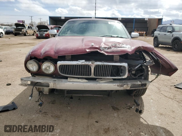 1998 Jaguar XJ Vanden Plas with VIN SAJKX6245WC830912, listed as a Copart auction lot 49717285 with 127,509 mi miles and Salvage Title. Bid and sale history available at DreamBid. Image 5.