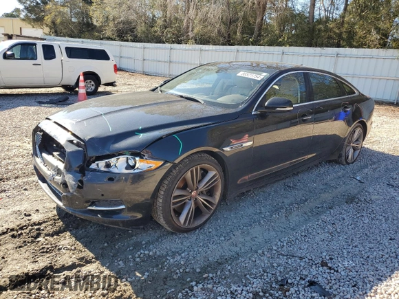 2015 Jaguar XJ with VIN SAJWA2GT8FMV83276, listed as a Copart auction lot 86521754 with 105,010 mi miles and Salvage Title. Bid and sale history available at DreamBid. Image 1.