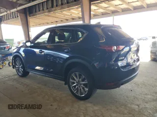 2019 Mazda CX-5 Grand Touring with VIN JM3KFADM3K1539890, listed as a Copart auction lot 57809835 with 56,079 mi miles and Salvage title. Bid and sale history available at DreamBid. Image 2.