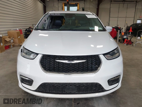 2022 Chrysler Pacifica Touring L with VIN 2C4RC1BGXNR144831, listed as a IAAI auction lot 40473026 with 36,495 mi miles and . Bid and sale history available at DreamBid. Image 12.