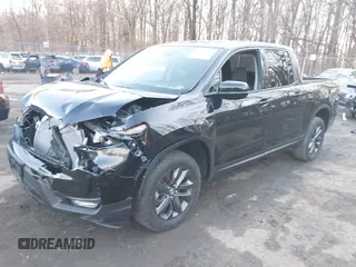 2024 Honda Ridgeline Sport with VIN 5FPYK3F14RB012334, listed as a IAAI auction lot 41542412 with 1,817 mi miles and . Bid and sale history available at DreamBid. Image 2.