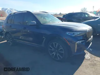 2021 BMW X7 M50i with VIN 5UXCX6C0XM9E15417, listed as a IAAI auction lot 41402910 with 70,768 mi miles. Bid and sale history available at carsss.com. Image 1.