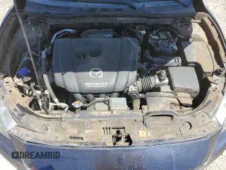 2015 Mazda 3 i Grand Touring z VIN 3MZBM1M72FM145070, wystawiony jako Copart lot #58419525 z przebiegiem 61 255 mil mil oraz Szkoda całkowita • Salvage title. Historia ofert i sprzedaży dostępna na DreamBid. Obrazek 11.