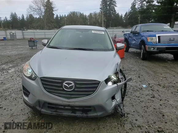 2016 Mazda CX-5 Sport z VIN JM3KE4BY5G0726376, wystawiony jako Copart lot #52009995 z przebiegiem 113 533 mil mil oraz Szkoda całkowita • Salvage title. Historia ofert i sprzedaży dostępna na DreamBid. Obrazek 11.