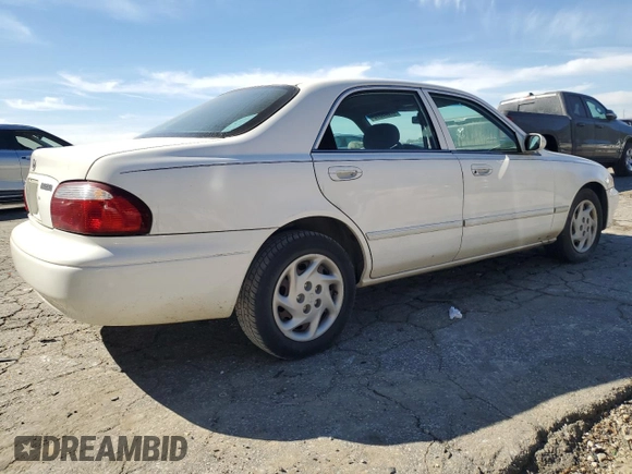 2001 Mazda 626 LX z VIN 1YVGF22C815240640, wystawiony jako Copart lot #47609315 z przebiegiem Nie podano mil oraz Szkoda całkowita • Salvage title. Historia ofert i sprzedaży dostępna na DreamBid. Obrazek 3.