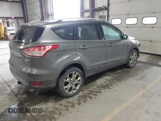2014 Ford Escape Titanium with VIN 1FMCU9J90EUC31625, listed as a IAAI auction lot 41492075 with 301,917 mi miles and . Bid and sale history available at DreamBid. Image 4.