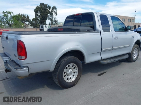 2001 Ford F-150 XL with VIN 1FTRX18L91KF29881, listed as a IAAI auction lot 42021554 with 199,041 mi miles. Bid and sale history available at carsss.com. Image 4.