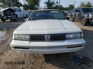 1996 Oldsmobile Cutlass Ciera 1SA VX5 z VIN 1G3AJ55M5T6394526, wystawiony jako Copart lot #72783674 z przebiegiem 77 988 mil mil oraz Szkody całkowita. Historia ofert i sprzedaży dostępna na DreamBid. Obrazek 5.