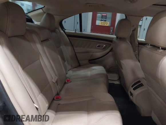 2014 Ford Taurus Limited z VIN 1FAHP2J8XEG112565, wystawiony jako IAAI lot #41554413 z przebiegiem 180 870 mil mil oraz . Historia ofert i sprzedaży dostępna na DreamBid. Obrazek 8.