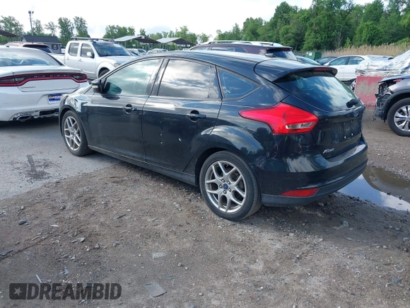 2015 Ford Focus SE with VIN 1FADP3K2XFL319559, listed as a IAAI auction lot 42205107 with 184,499 mi miles. Bid and sale history available at carsss.com. Image 3.