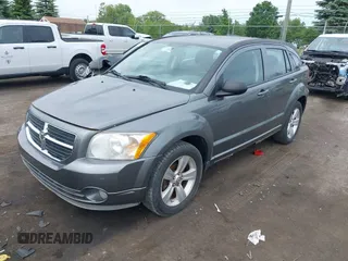 2012 Dodge Caliber SXT z VIN 1C3CDWDA6CD532023, wystawiony jako IAAI lot #42381719 z przebiegiem 210 000 mil mil oraz . Historia ofert i sprzedaży dostępna na DreamBid. Obrazek 2.
