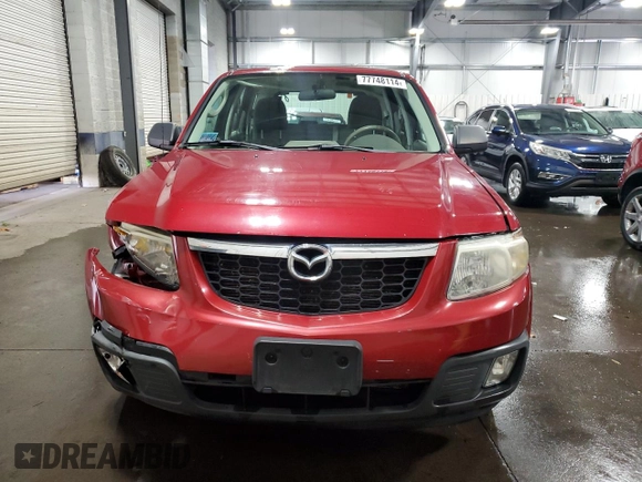 2011 Mazda Tribute Touring with VIN 4F2CY0C71BKM06780, listed as a Copart auction lot 77748114 with 144,163 mi miles and Salvage Title. Bid and sale history available at carsss.com. Image 5.