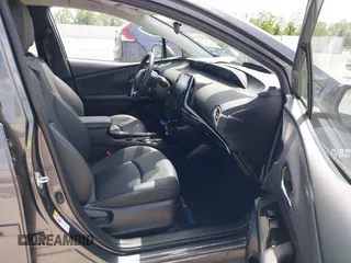 2021 Toyota Prius LE with VIN JTDKAMFP3M3193640, listed as a IAAI auction lot 42023593 with 17,841 mi miles and . Bid and sale history available at DreamBid. Image 5.