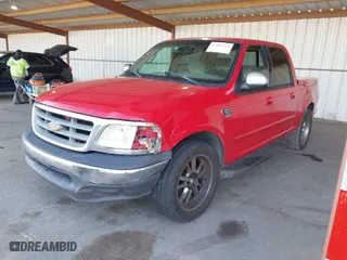 2001 Ford F-150 SuperCrew XLT with VIN 1FTRW07W61KB16745, listed as a IAAI auction lot 42001221 with 260,200 mi miles. Bid and sale history available at carsss.com. Image 2.
