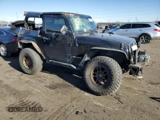 2009 Jeep Wrangler Rubicon with VIN 1J4GA64169L765933, listed as a Copart auction lot 84963104 with 107,190 mi miles and Salvage Title. Bid and sale history available at DreamBid. Image 4.