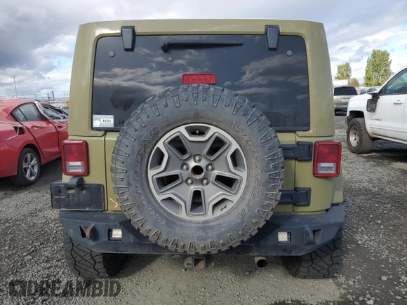 2013 Jeep Wrangler Unlimited Rubicon 10th Anniversary with VIN 1C4HJWFG4DL549065, listed as a Copart auction lot 75899594 with 127,960 mi miles and Salvage title. Bid and sale history available at DreamBid. Image 6.