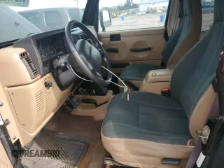 2000 Jeep Wrangler Sahara with VIN 1J4FA59S5YP761127, listed as a Copart auction lot 65247225 with 174,274 mi miles and Clean title. Bid and sale history available at DreamBid. Image 7.