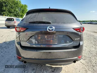 2020 Mazda CX-5 Grand Touring z VIN JM3KFADM2L0803589, wystawiony jako Copart lot #61916825 z przebiegiem 63 663 mil mil oraz Szkoda całkowita • Salvage title. Historia ofert i sprzedaży dostępna na DreamBid. Obrazek 6.