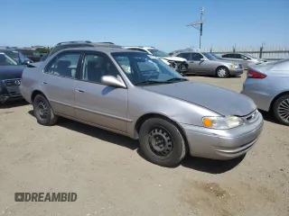 1998 Toyota Corolla VE with VIN 1NXBR18E6WZ080700, listed as a Copart auction lot 58605135 with 214,928 mi miles and Salvage title. Bid and sale history available at DreamBid. Image 4.