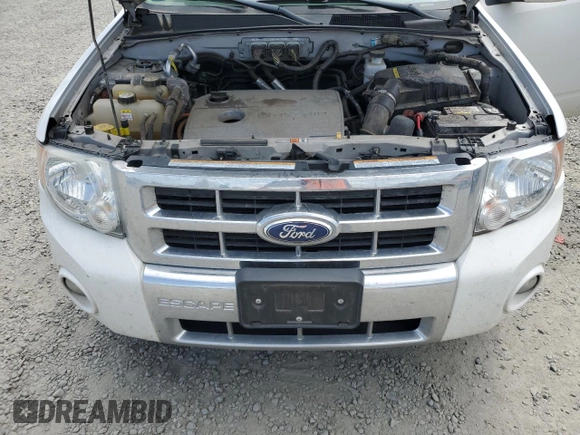 2010 Ford Escape Hybrid z VIN 1FMCU5K30AKC45288, wystawiony jako Copart lot #53479505 z przebiegiem 111 458 mil mil oraz Szkoda całkowita • Salvage title. Historia ofert i sprzedaży dostępna na DreamBid. Obrazek 12.