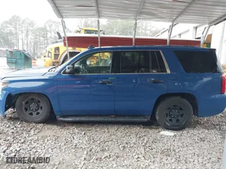 2015 Chevrolet Tahoe Commercial with VIN 1GNSK2EC1FR663199, listed as a IAAI auction lot 41552787 with 148,187 mi miles. Bid and sale history available at carsss.com. Image 14.