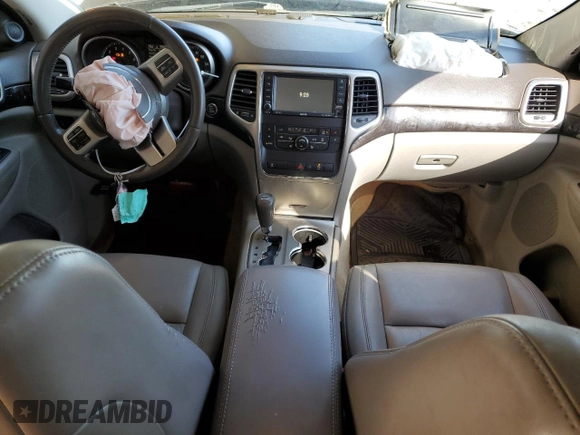 2012 Jeep Grand Cherokee Laredo with VIN 1C4RJEAG2CC215525, listed as a Copart auction lot 51876105 with 148,659 mi miles and Salvage Title. Bid and sale history available at carsss.com. Image 8.