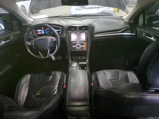 2017 Ford Fusion Titanium z VIN 3FA6P0K96HR124759, wystawiony jako Copart lot #61414395 z przebiegiem 175 655 mil mil oraz Czysty tytuł • Clean title. Historia ofert i sprzedaży dostępna na DreamBid. Obrazek 8.