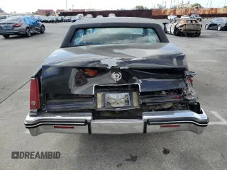 1985 Cadillac Eldorado z VIN 1G6EL578XFE640091, wystawiony jako Copart lot #71849374 z przebiegiem 30 631 mil mil oraz Szkody całkowita. Historia ofert i sprzedaży dostępna na DreamBid. Obrazek 6.