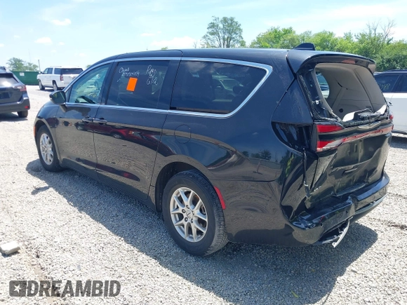 2023 Chrysler Pacifica Touring L with VIN 2C4RC1BG1PR606504, listed as a IAAI auction lot 42647652 with 41,598 mi miles and . Bid and sale history available at DreamBid. Image 3.
