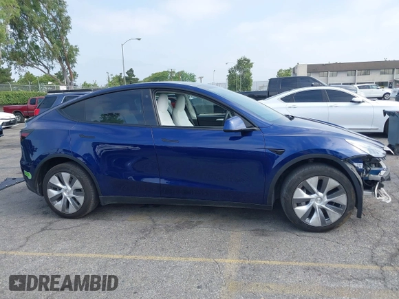 2023 Tesla Model Y Long Range z VIN 7SAYGDEE5PA102285, wystawiony jako IAAI lot #42402981 z przebiegiem 24 550 mil mil oraz . Historia ofert i sprzedaży dostępna na DreamBid. Obrazek 14.