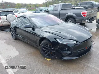 2022 Tesla Model S Plaid with VIN 5YJSA1E60NF460244, listed as a IAAI auction lot 41996403 with Not provided miles and . Bid and sale history available at DreamBid. Image 1.