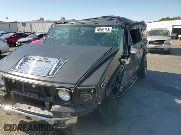 2003 Hummer H2 with VIN 5GRGN23U83H134284, listed as a Copart auction lot 70259154 with 0 mi miles and Salvage Title. Bid and sale history available at carsss.com. Image 12.