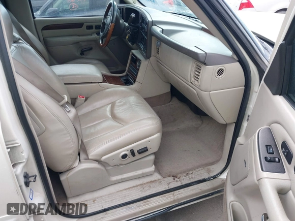 2003 Cadillac Escalade z VIN 1GYEK63N53R304400, wystawiony jako IAAI lot #41544697 z przebiegiem 207 913 mil mil oraz . Historia ofert i sprzedaży dostępna na DreamBid. Obrazek 5.