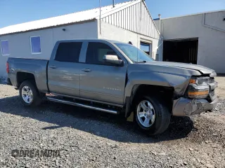 2017 Chevrolet Silverado 1500 LT with VIN 3GCUKREC0HG335785, listed as a Copart auction lot 51456305 with 104,614 mi miles and Salvage Title. Bid and sale history available at DreamBid. Image 4.