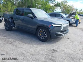 2022 Rivian R1T Launch Edition with VIN 7FCTGAAL9NN004060, listed as a IAAI auction lot 41637884 with 40,268 mi miles. Bid and sale history available at carsss.com. Image 1.