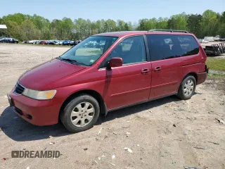 2002 Honda Odyssey EX-L with VIN 2HKRL18952H577121, listed as a Copart auction lot 52752955 with 334,009 mi miles and Salvage title. Bid and sale history available at DreamBid. Image 1.