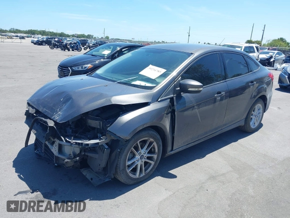 2016 Ford Focus SE z VIN 1FADP3F25GL338158, wystawiony jako IAAI lot #39234785 z przebiegiem 77 333 mil mil oraz . Historia ofert i sprzedaży dostępna na DreamBid. Obrazek 2.