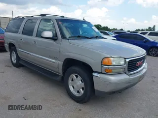 2004 GMC Yukon XL SLT z VIN 1GKEC16Z14J140345, wystawiony jako IAAI lot #42453386 z przebiegiem Nie podano mil oraz . Historia ofert i sprzedaży dostępna na DreamBid. Obrazek 1.