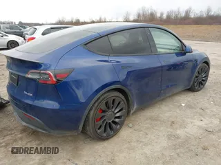 2020 Tesla Model Y Long Range with VIN 5YJYGDEF0LF000380, listed as a IAAI auction lot 41867489 with 66,294 mi miles and . Bid and sale history available at DreamBid. Image 4.