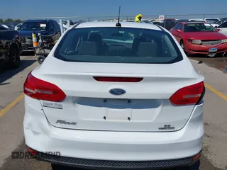 2016 Ford Focus SE z VIN 1FADP3F23GL338496, wystawiony jako IAAI lot #42333608 z przebiegiem 76 972 mil mil oraz . Historia ofert i sprzedaży dostępna na DreamBid. Obrazek 17.