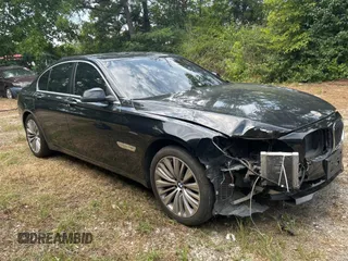 2015 BMW 7 Series 740i with VIN WBAYA6C58FD826958, listed as a Copart auction lot 63928645 with 143,521 mi miles and Salvage title. Bid and sale history available at DreamBid. Image 1.