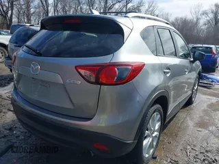 2014 Mazda CX-5 Grand Touring with VIN JM3KE2DY8E0375025, listed as a IAAI auction lot 41657755 with 103,601 mi miles. Bid and sale history available at carsss.com. Image 4.