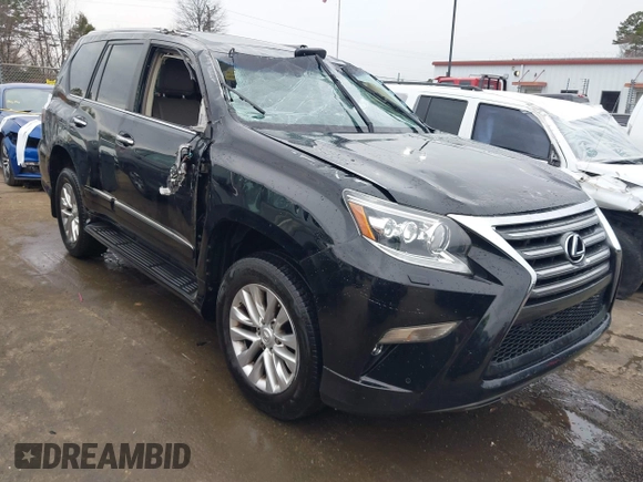 2014 Lexus GX 460 with VIN JTJBM7FX6E5073973, listed as a IAAI auction lot 41610332 with 128,870 mi miles. Bid and sale history available at carsss.com. Image 1.