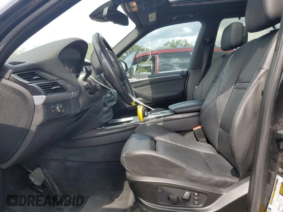 2012 BMW X5 50i with VIN 5UXZV8C51CL424965, listed as a Copart auction lot 64414455 with 121,894 mi miles and Clean title. Bid and sale history available at DreamBid. Image 7.