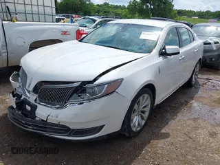 2014 Lincoln MKS z VIN 1LNHL9DK7EG601720, wystawiony jako IAAI lot #42464979 z przebiegiem 58 163 mil mil oraz . Historia ofert i sprzedaży dostępna na DreamBid. Obrazek 17.