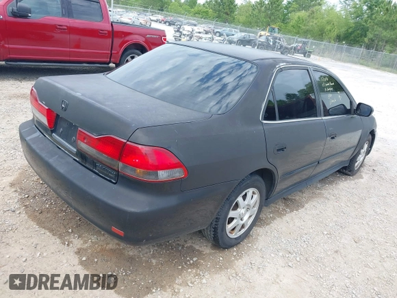 2002 Honda Accord SE z VIN 1HGCG668X2A171099, wystawiony jako IAAI lot #42081358 z przebiegiem 215 915 mil mil oraz . Historia ofert i sprzedaży dostępna na DreamBid. Obrazek 4.